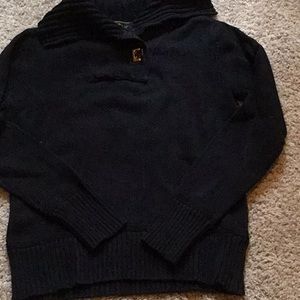 Woman’s dark blue sweater